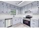 Nicely appointed kitchen featuring stainless steel appliances and ample cabinet space at 2931 Randolph Ct, Conyers, GA 30012