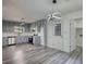 Spacious kitchen featuring gray cabinets, stainless steel appliances, and stylish lighting at 2931 Randolph Ct, Conyers, GA 30012