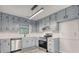 Well-lit kitchen with gray cabinets, stainless steel appliances, and modern countertops at 2931 Randolph Ct, Conyers, GA 30012