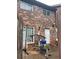 Brick townhouse back patio with gym equipment offers private outdoor living space at 658 Garden Walk Dr, Stone Mountain, GA 30083