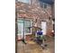 Brick townhouse back patio showing outdoor workout equipment, creating a private and functional space at 658 Garden Walk Dr, Stone Mountain, GA 30083