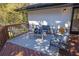 Cozy outdoor back deck featuring stylish seating with a sleek outdoor rug and backyard views at 696 Kenilworth Cir, Stone Mountain, GA 30083