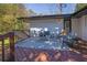 Cozy outdoor back deck featuring stylish seating with a sleek outdoor rug and backyard views at 696 Kenilworth Cir, Stone Mountain, GA 30083