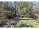 View of backyard showcasing lush landscaping and natural beauty at 696 Kenilworth Cir, Stone Mountain, GA 30083