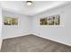 Carpeted bedroom featuring neutral walls and lots of natural light at 696 Kenilworth Cir, Stone Mountain, GA 30083