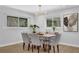 Bright dining area featuring a wood table with seating for six and modern chandelier at 696 Kenilworth Cir, Stone Mountain, GA 30083