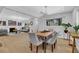 Open dining area adjacent to living room featuring a wood table with seating for six at 696 Kenilworth Cir, Stone Mountain, GA 30083