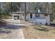 Charming renovated home with white painted brick and a covered carport, great curb appeal at 696 Kenilworth Cir, Stone Mountain, GA 30083