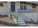Inviting front entrance with concrete steps leading to a well-maintained exterior at 696 Kenilworth Cir, Stone Mountain, GA 30083
