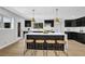 Spacious kitchen featuring an island with seating and modern lighting at 696 Kenilworth Cir, Stone Mountain, GA 30083