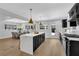 Bright kitchen with a large island, stainless appliances, and pendant lighting at 696 Kenilworth Cir, Stone Mountain, GA 30083