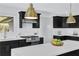 Stylish kitchen boasting stainless appliances, black cabinets, and white countertops at 696 Kenilworth Cir, Stone Mountain, GA 30083