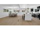 Bright, open kitchen with island, stainless appliances, and adjacent dining area perfect for entertaining at 696 Kenilworth Cir, Stone Mountain, GA 30083
