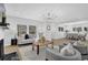 Bright living room featuring large windows, fireplace, and stylish furniture, great for relaxing at 696 Kenilworth Cir, Stone Mountain, GA 30083
