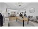 Open-concept living area showcases modern furnishings and seamless flow to kitchen and dining at 696 Kenilworth Cir, Stone Mountain, GA 30083