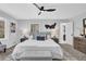 Spacious main bedroom with bay window, sleek ceiling fan, and an ensuite bathroom access at 696 Kenilworth Cir, Stone Mountain, GA 30083
