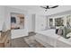 Bright main bedroom boasts a ceiling fan, bay window, and neutral paint, creating a serene retreat at 696 Kenilworth Cir, Stone Mountain, GA 30083