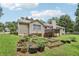 Large backyard featuring garden beds and a deck at 105 Laney Ct, Mcdonough, GA 30252