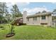 A lush backyard with fenced perimeter and home's rear elevation at 105 Laney Ct, Mcdonough, GA 30252