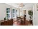 Cozy dining area with natural light, hardwood floors, ceiling fan, and a view of the outdoors at 105 Laney Ct, Mcdonough, GA 30252