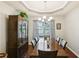 Elegant dining room with tray ceiling and large window, perfect for Gathering gatherings and entertaining at 105 Laney Ct, Mcdonough, GA 30252