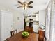 Dining area offering an open layout into the kitchen with a view through the window and access to a kitchen at 105 Laney Ct, Mcdonough, GA 30252