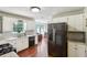 Bright kitchen features stainless steel appliances, ample cabinet space, and a large window at 105 Laney Ct, Mcdonough, GA 30252