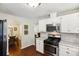 Cozy kitchen with stainless steel appliances and adjoining dining area at 105 Laney Ct, Mcdonough, GA 30252