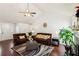 Open-concept living room with hardwood floors, fireplace, and plenty of natural light at 105 Laney Ct, Mcdonough, GA 30252
