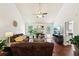 Bright living room with vaulted ceilings, fireplace, hardwood floors, and a cozy seating arrangement at 105 Laney Ct, Mcdonough, GA 30252