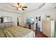 Spacious main bedroom featuring hardwood floors and a TV at 105 Laney Ct, Mcdonough, GA 30252