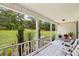 Relaxing front porch view with seating and decorative plants overlooking the well-maintained lawn and lush greenery at 105 Laney Ct, Mcdonough, GA 30252