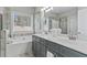 Beautiful bathroom featuring a double vanity, soaking tub, and tiled shower for a spa-like experience at 15 Azalea Lakes Ct, Dallas, GA 30157
