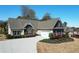 Charming single-story home featuring a lush, landscaped front yard and an attached two-car garage at 15 Azalea Lakes Ct, Dallas, GA 30157