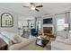 Spacious living room featuring hardwood floors, fireplace and views into breakfast nook and kitchen at 15 Azalea Lakes Ct, Dallas, GA 30157