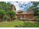 Beautiful backyard with green grass, a large deck, and mature trees providing ample shade at 170 Glen Eagle Way, Mcdonough, GA 30253