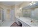 Spacious bathroom featuring double sinks, large mirror, shower, and tile flooring at 170 Glen Eagle Way, Mcdonough, GA 30253