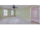 Spacious bedroom with a ceiling fan and light green walls at 170 Glen Eagle Way, Mcdonough, GA 30253