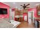 Well-lit kitchen boasts granite counters, wood cabinets, and modern appliances at 170 Glen Eagle Way, Mcdonough, GA 30253