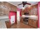 Kitchen features wooden cabinets, granite countertops, and stainless steel appliances at 170 Glen Eagle Way, Mcdonough, GA 30253