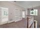 Landing with a built-in bookshelf and staircase at 170 Glen Eagle Way, Mcdonough, GA 30253