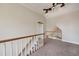 Upstairs landing with a wood railing, carpet, and neutral paint at 170 Glen Eagle Way, Mcdonough, GA 30253
