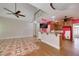 Open-concept design with tiled living space leading into kitchen area at 170 Glen Eagle Way, Mcdonough, GA 30253