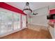 Living room with shuttered glass doors and adjacent dining area at 170 Glen Eagle Way, Mcdonough, GA 30253