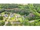 Sprawling property with a serene lake, lush greenery, and charming homes nestled within at 8070 Johnson Rd, Palmetto, GA 30268