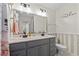 This updated bathroom boasts a double vanity and lots of storage space at 8070 Johnson Rd, Palmetto, GA 30268