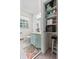 Bathroom features storage closet with shelves and cabinet with a blue vanity at 8070 Johnson Rd, Palmetto, GA 30268