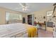Bright bedroom with a ceiling fan, closet, and a separate vanity area at 8070 Johnson Rd, Palmetto, GA 30268