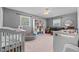Playful bedroom featuring lots of toys, colorful organizers and grey walls at 8070 Johnson Rd, Palmetto, GA 30268