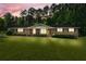 Charming brick home featuring a well-manicured lawn and front-facing shrubs at 8070 Johnson Rd, Palmetto, GA 30268